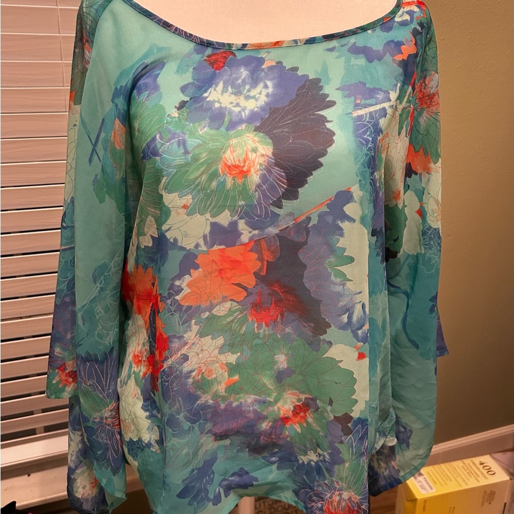 Sheer and light top by ana that can be worn over a tank or over a bikini top.